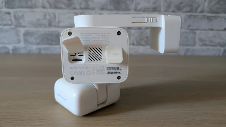 The rear of the Tapo C645D, showing its microSD card slot and rubber flaps