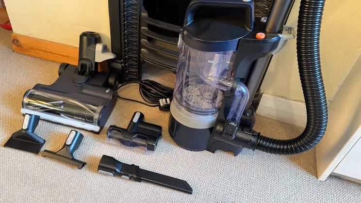 The Vax LiftOut Multi Pet Design Upright Vacuum and its attachments, laid out on the floor