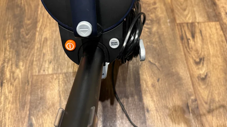 A closeup of the Vax LiftOut Multi Pet Design Upright Vacuum's controls, including on/off button and brush control
