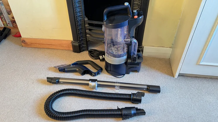 The Vax LiftOut Multi Pet Design Upright Vacuum in its constituent parts, disassembled and laid out on the floor