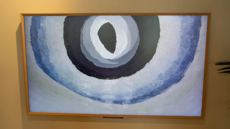 The Amazon Ember Artline QLED TV displaying an abstract piece of art that looks a bit like an eye