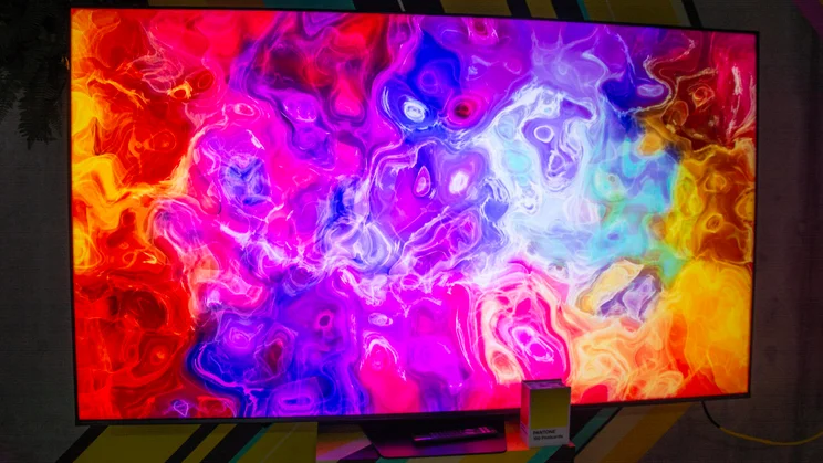 The Hisense UR8S RGB Mini LED TV displaying marbled colours across its screen