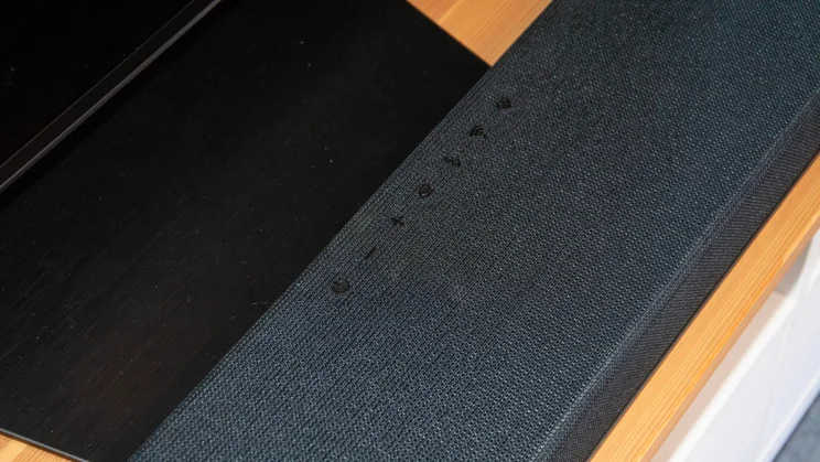 Top-down view of the controls on top of the LG Sound Suite H7 soundbar