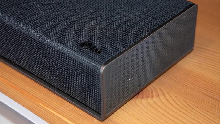 Close-up of the side-firing driver at the right end of the LG Sound Suite H7 soundbar