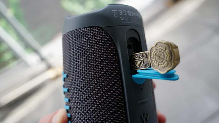 A USB-A memory stick plugged into the Majority Move M3 portable Bluetooth speaker