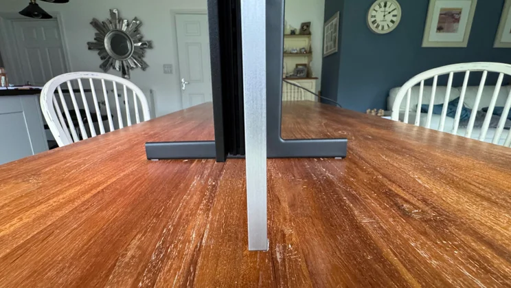 Side view of the Samsung S99H quantum dot OLED showing its stand and profile