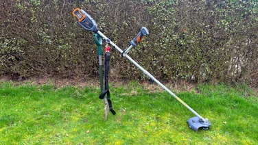 VonHaus 36V cordless 2-in-1 grass trimmer - wide shot of trimmer propped up on grass