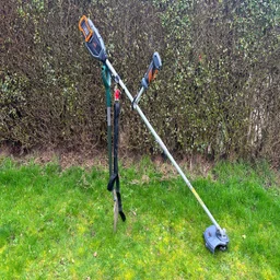 VonHaus 36V cordless 2-in-1 grass trimmer - wide shot of trimmer propped up on grass