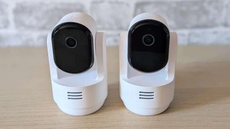 A pair of Arlo Essential 3 pan tilt security cameras pictured from the front
