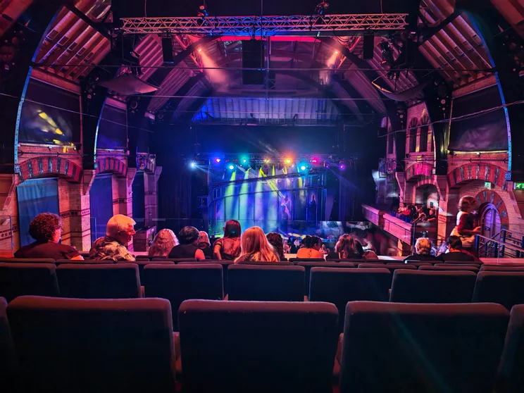 An audience in front of a stage