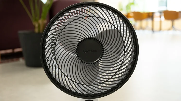 A closeup of the Meaco Sefte Pro 10in Pedestal Fan's head and fan grill