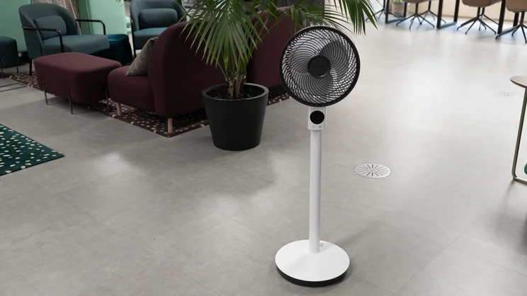 The Meaco Sefte Pro 10in Pedestal Fan at its full height, in an office