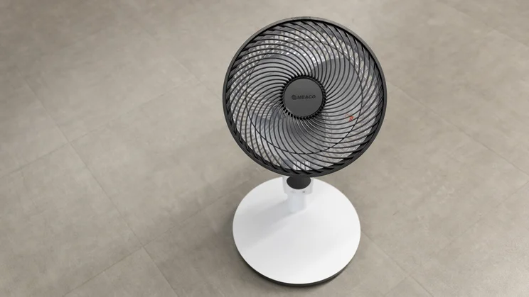 The Meaco Sefte Pro 10in Pedestal Fan at its lowest height on the floor of an office, viewed from above