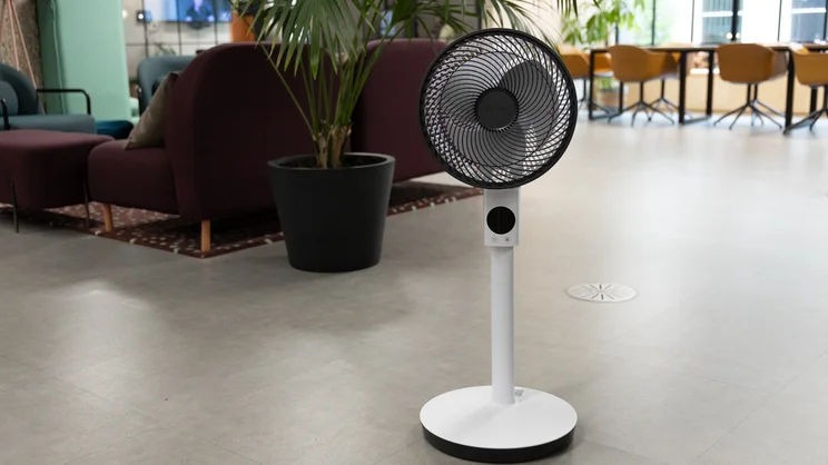 The Meaco Sefte Pro 10in Pedestal Fan at its medium height in an office