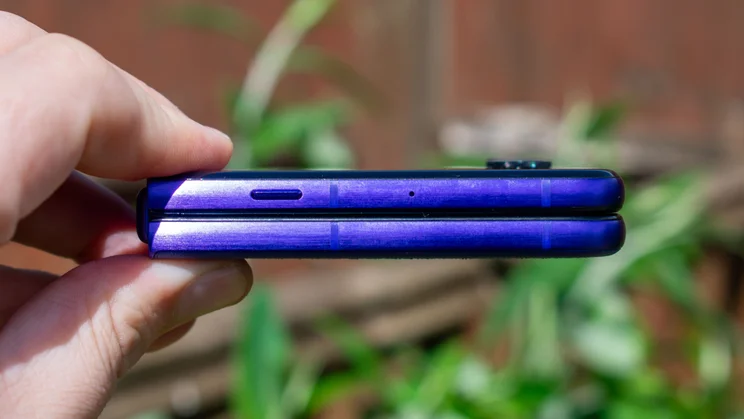Motorola Razr 70 Ultra folded in hand, side view