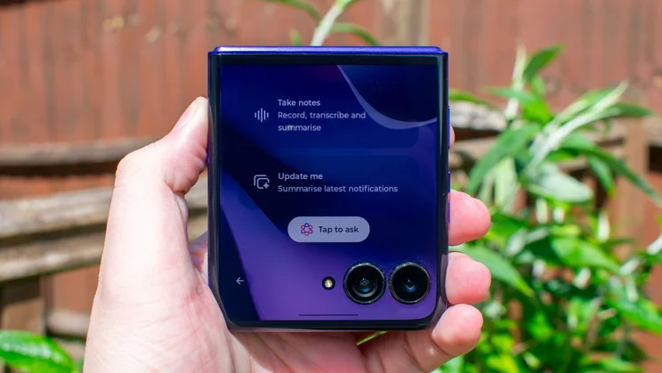 Motorola Razr 70 Ultra in hand, displaying the AI features