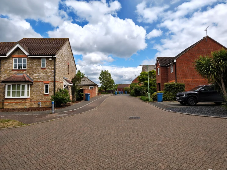 A quiet street with houses on both sides