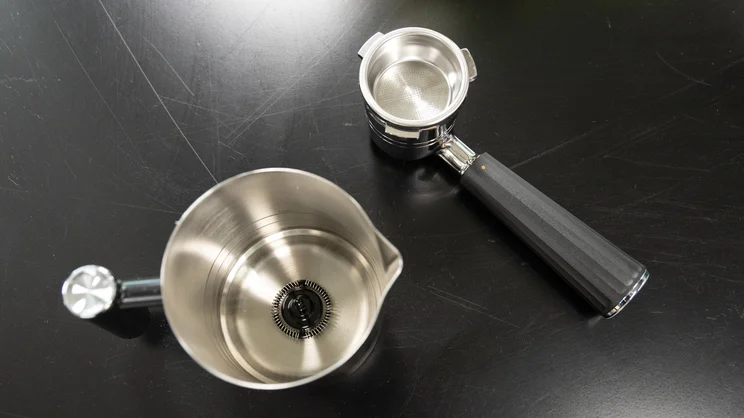 A bird's eye view of the Ninja Luxe Cafe Pro espresso machine's portafilter and milk jug