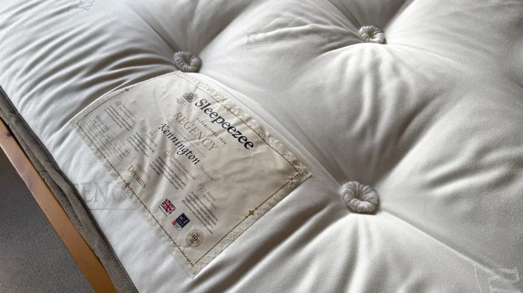 A closeup of the Sleepeezee Regency Kennington 4200 mattress' surface, showing its brand label