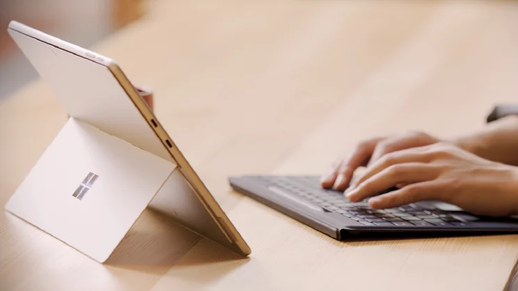 Surface pro for business lifestyle image of laptop being used on a desk