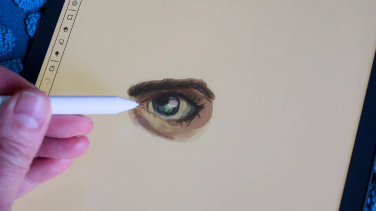 The Amazon Kindle Scribe Colorsoft with a picture of an eye on screen