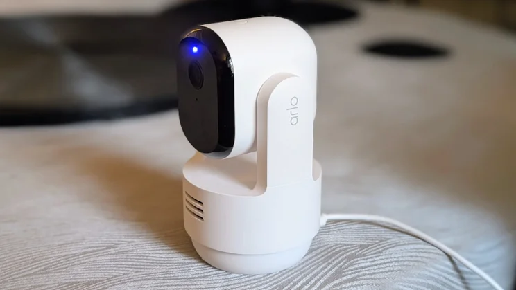 The Arlo Essential 3 pan tilt security camera plugged in pictured from the front right quarter