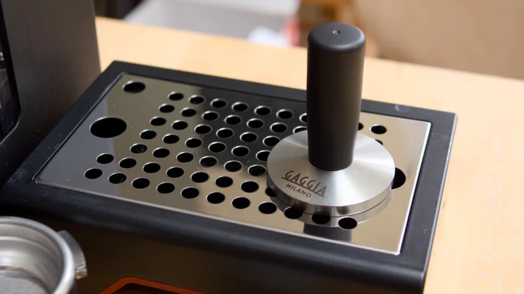 The Gaggia Classic UP's drip tray and supplied steel tamper