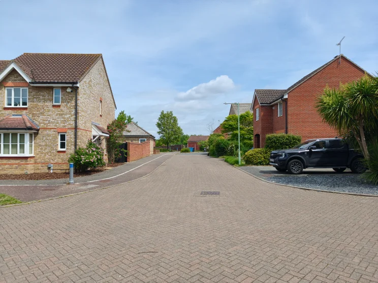 A quiet street with houses on both sides