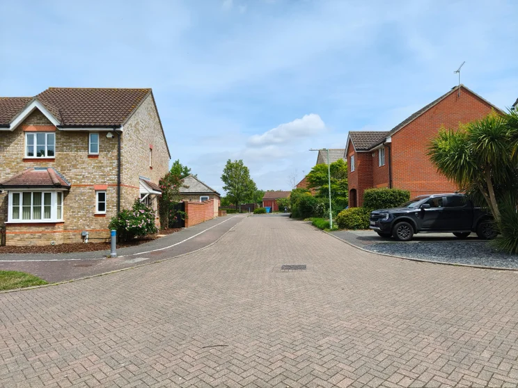 A quiet street with houses on both sides