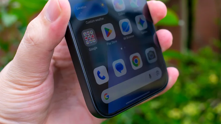 Xiaomi 17T in hand, angled view of display