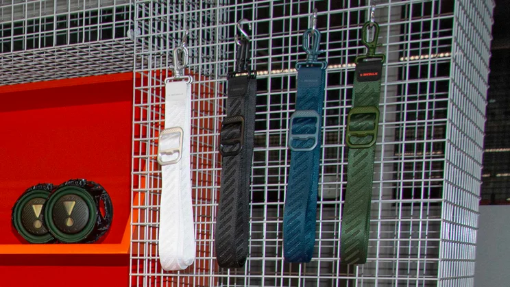 Four JBL Xtreme 5 straps hanging on a metallic cage