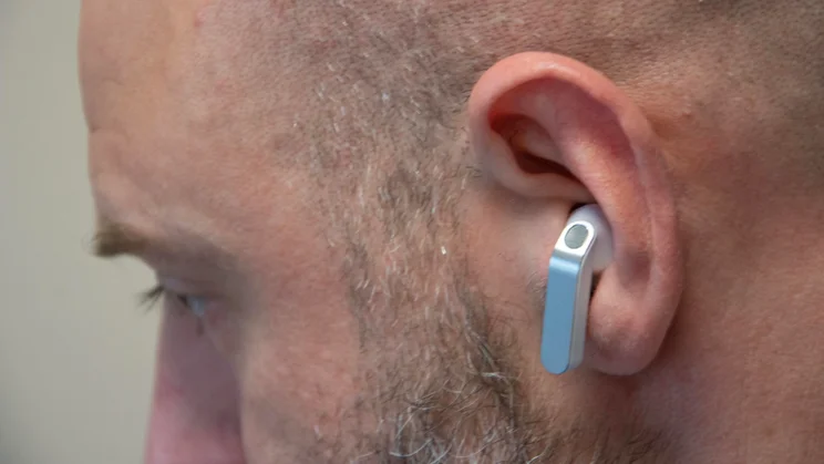 The left earbud of the Samsung Galaxy Buds4 being worn by a white male