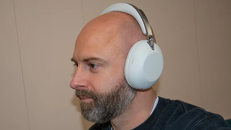 Angled view of the Sony 1000X The Collexion over-ear headphones being worn