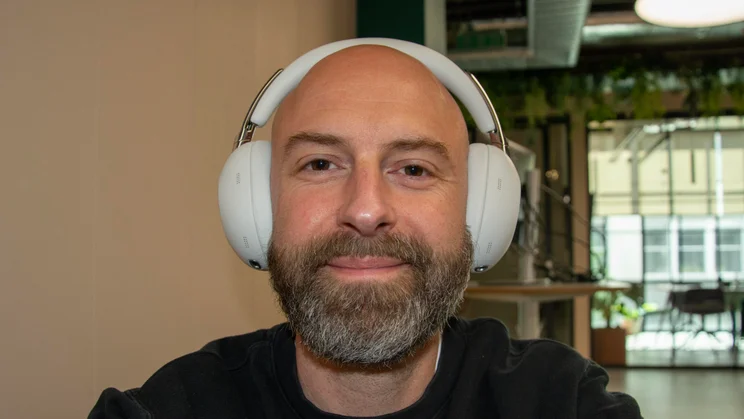 Front view of the Sony 1000X The Collexion over-ear headphones being worn