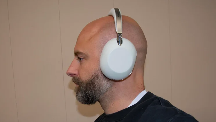 Side view of the Sony 1000X The Collexion over-ear headphones being worn