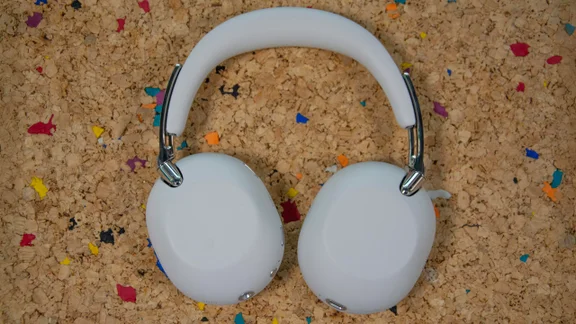 Top-down view of the Sony 1000X The Collexion over-ear headphones lying earcups-down on a cork table