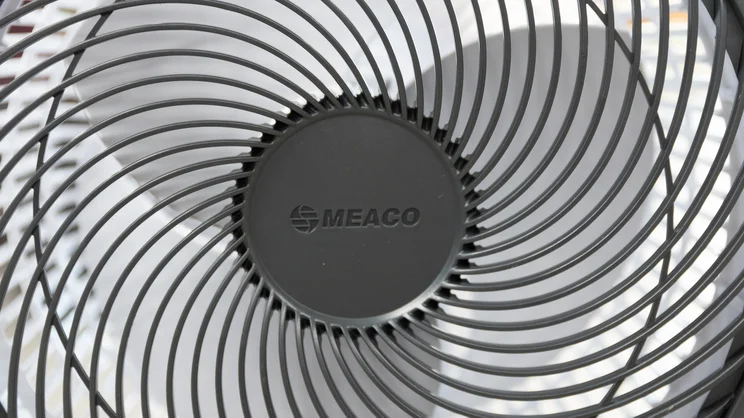 A closeup of the Meaco Sefte Pro 10in Pedestal Fan's head and fan grill