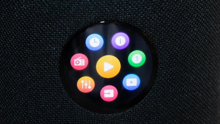 The digital display on the WiiM Sound wireless speaker showing the group menu options