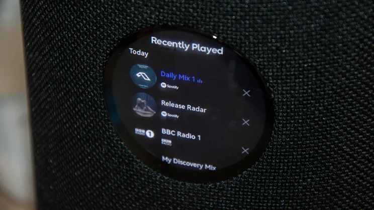 The digital display on the WiiM Sound wireless speaker showing the Recently Played options