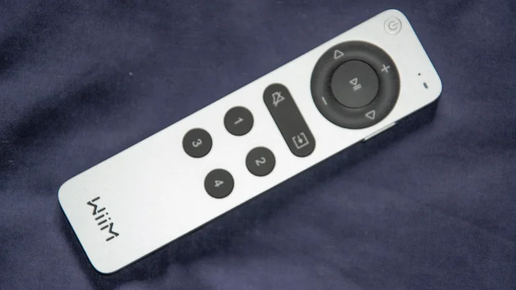 The remote control included with the WiiM Sound wireless speaker