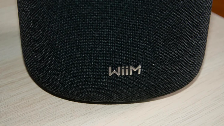 Close-up of the WiiM logo on the bottom of the WiiM Sound wireless speaker