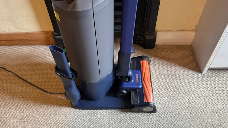 A close up picture of the Shark PowerDetect Speed Clean and Empty Pet Pro in its docking station