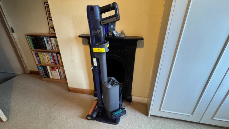 A picture, from the left side, of the Shark PowerDetect Speed Clean and Empty Pet Pro in its docking station