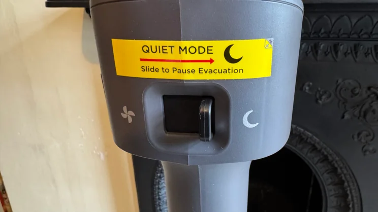 A picture of the quiet mode switch on the Shark PowerDetect Speed Clean and Empty Pet Pro's docking station