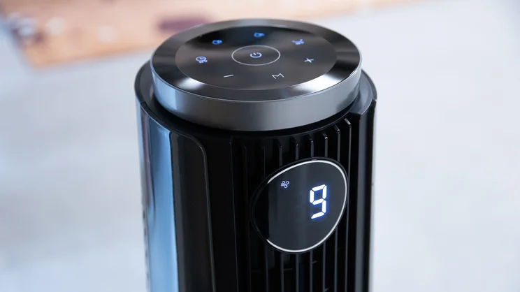 A closeup of the top of the Dreo TurboCool Misting Fan 765S. Its digital display is on
