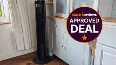 The Levoit Classic Pro Tower Fan in a living room. A roundel badge to the right reads "Expert Reviews Approved Deal"