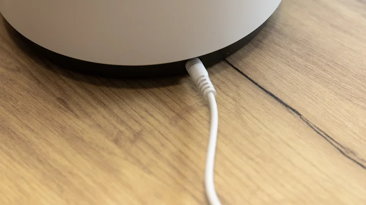 A closeup of the rear base of the Meaco Sefte 6in Air Circulator, with charging cable plugged in