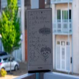 PocketBook InkPad One on a balcony, display in sleep mode