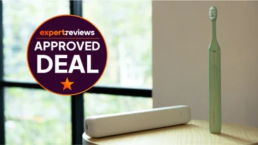 The Suri 2.0 electric toothbrush on a table. To the left, a roundel badge reads "Expert Reviews Approved Deal"