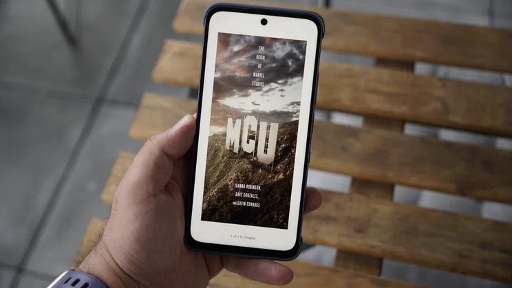 TCL Nxtpaper 70 Pro in hand, displaying a book cover in colour ink mode